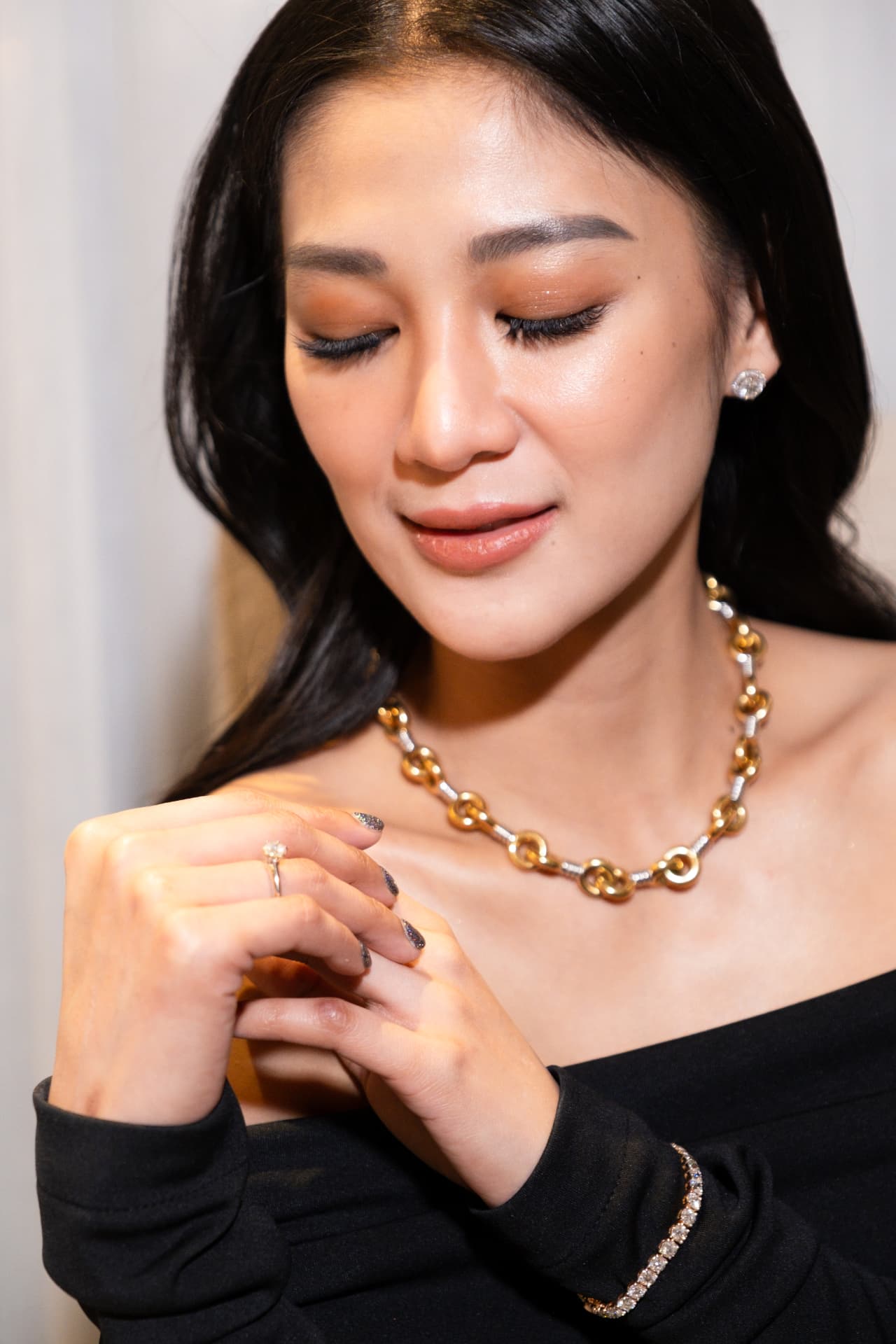 Gold chain necklace worn on model