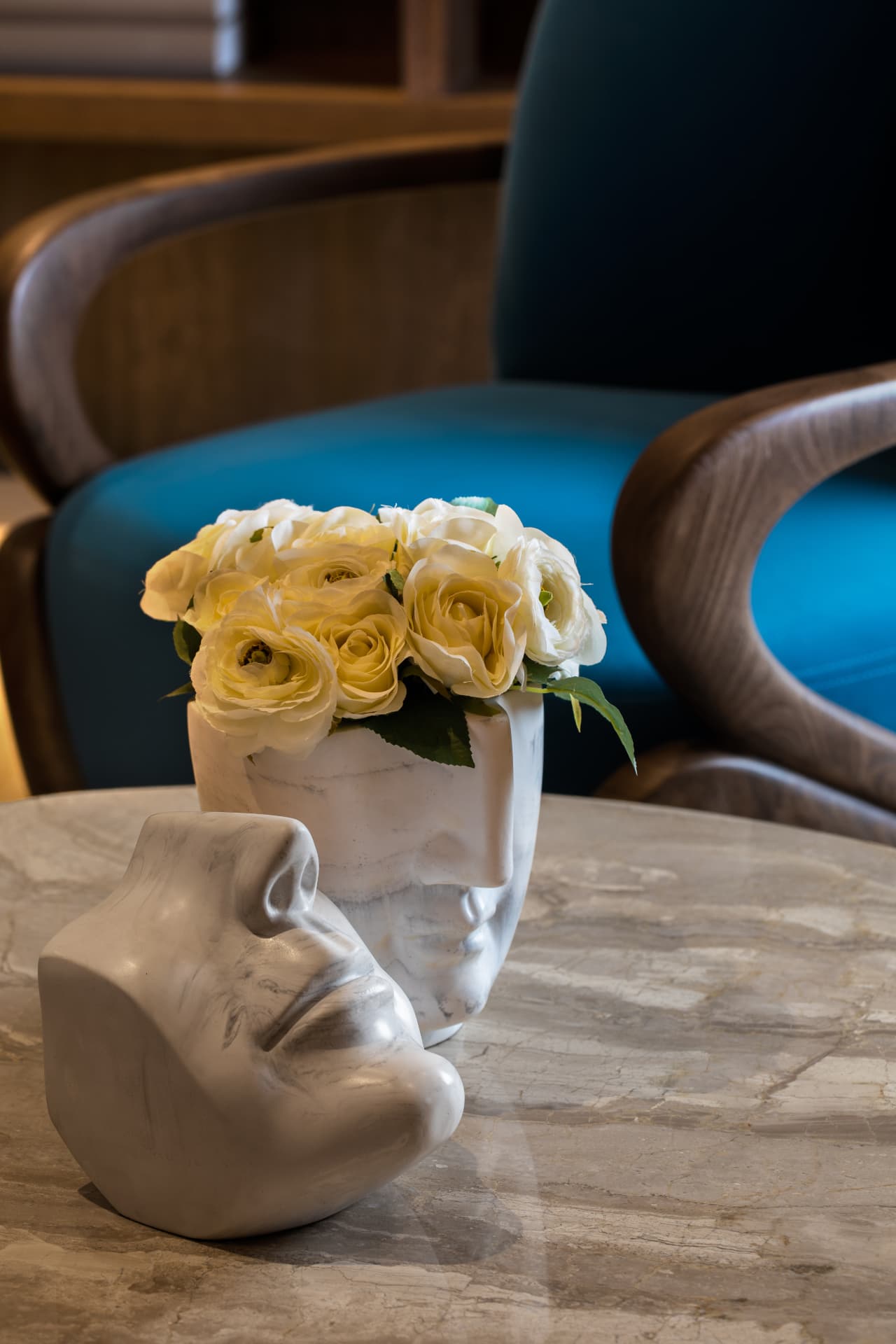 Marble sculpture and roses styled interior detail